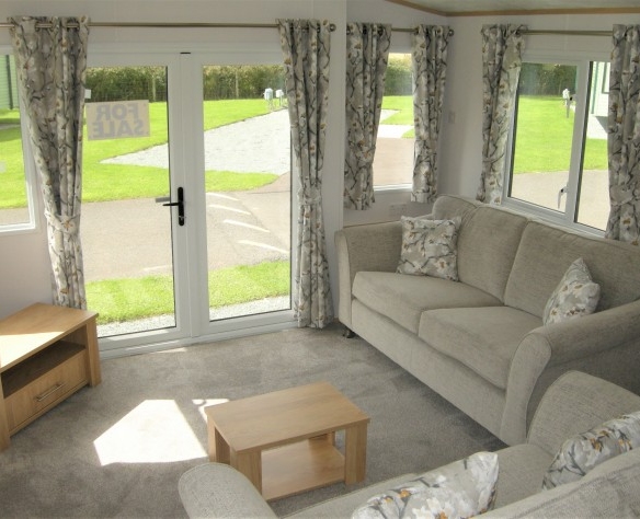 holiday lodge for sale living room with double doors leading outside