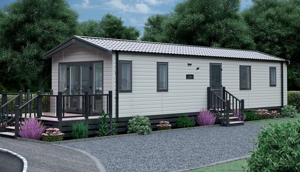 holiday lodges to buy exterior of vendee type lodge with driveway and garden